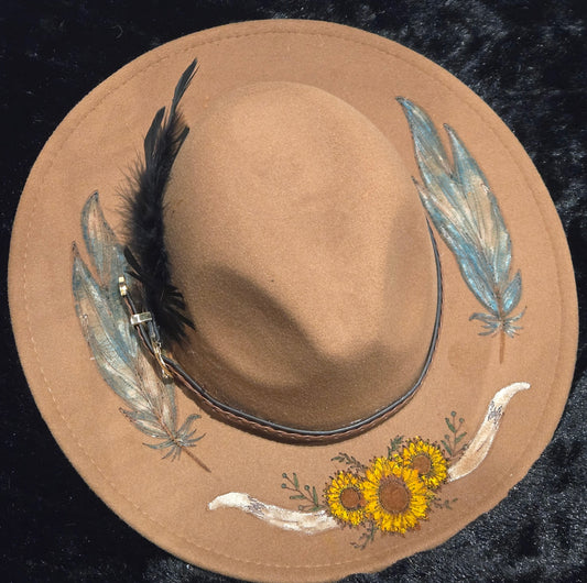 Engraved Sunflower with steer horns and feathers